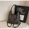 Versatile black matte leather tote bag for women showing the unique three-way carry style - Black without Pendant