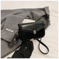 Glossy black leather crossbody square bag with silver twist lock and woven charm - Black With Charm