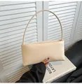 Minimalist beige baguette shoulder bag with slim strap and sleek rectangular design - White