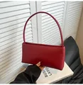 Minimalist dark red baguette bag in premium smooth leather with a slim shoulder handle - Red