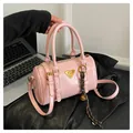 Pink bowling bag in glossy patent leather with top handles and adjustable strap - Pink