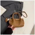 Brown lychee texture tote bag with chain strap and heart charm detail in a modern style - With Ornament / Brown