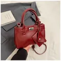 Minimalist square crossbody handbag in burgundy leather with silver lock detail - Red