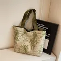 Canvas tote bag with bamboo leaf print and olive green straps for daily commute - Green