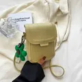 Light green minimalist mini crossbody phone bag with matching flower charm accessory - Yellow
