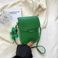 Chic vibrant green mini crossbody phone bag with matching floral pendant and slim strap - Green