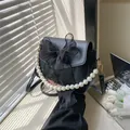 Elegante schwarze Umhängetasche mit großer Organzaschleife und Perlen griff für den Sommer - Schwarz