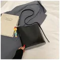 Minimalist black leather bucket shoulder bag with cute cartoon charm accessory - With Ornament / Black