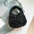 Elegant black pleated petal shoulder bag with soft satin ruffles and integrated handle - Black
