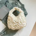 Chic cream white pleated ruffle handbag in glossy satin for elegant spring fashion - White