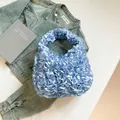 Light blue pleated cloud bag in premium satin finish with wavy texture and soft handle - Blue