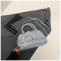 Light blue Boston bag with vintage texture, dual front pockets and pearl bow charm - With Pendant / Blue