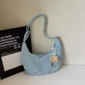 Light blue dumpling bag with cartoon cat print and adjustable strap in minimalist style - Blue (With Charm)