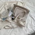 Transparent PVC tote bag with cream leather inner pouch and cute panda charm accessory - Clear White