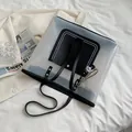 Transparent PVC tote bag with black trim and checkerboard charm for stylish women - Jelly Black