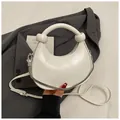 Mini white crescent dumpling handbag with knotted handle and elegant chain strap - Off White