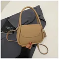 Elegant camel lychee grain handbag with adjustable shoulder strap and round handle - Khaki