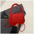 Red lychee textured top handle crossbody bag with NICEER & BAGS embossed logo - Red