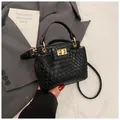 Minimalist black woven texture handbag with golden metal lock and round ring handle - Woven Texture / Black