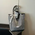 Chic black and white checkered tote bag with lace bow and woven label detail - Black
