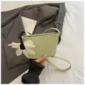 Chic light green woven bucket bag for women with delicate white flower charm decoration - Green