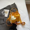 Fashionable bright yellow nylon drawstring crossbody bag with white moon plush charm - With Ornament / Yellow