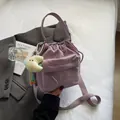 Purple nylon drawstring shoulder bag with front zipper pocket and adjustable strap - With Ornament / Purple
