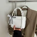 White bucket tote bag with woven rope handle and checkered lace bow detail - White