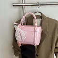 Pink mini bucket bag with glossy faux leather and lace bow detail for women - Pink