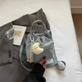 Light blue nylon drawstring bucket bag with moon plush charm and crossbody strap - With Ornament / Blue
