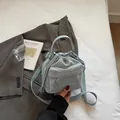 Light blue nylon drawstring crossbody bag with adjustable strap and top handle - No Pendant / Blue