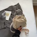 Chic beige nylon drawstring bucket bag with adjustable crossbody strap and embroidery - No Pendant / Off White