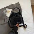 Fashionable black nylon drawstring bucket bag with adjustable crossbody strap for women - No Pendant / Black