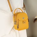 Yellow nylon small crossbody bag with triple zippers and adjustable shoulder strap - Yellow