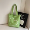 Grass green canvas tote bag with white heart embroidery and a silver heart-shaped stud - Green