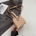 Beige patent leather box bag with top handle and adjustable crossbody strap - Khaki