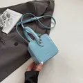 Mini light blue patent leather box bag with silver hardware and top handle for women - Blue
