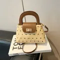 Retro lattice canvas handbag with brown leather accents and gold metal twist lock - Khaki