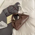 Brown PU leather tote bag with circular handles and delicate ribbon bow accents - Coffee without Pendant