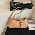 Minimalist light brown leather crescent shoulder bag with silver buckle and thin strap - Khaki