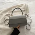 Elegant medium grey square handbag with glitter flap and metallic logo in variant grey - Gray