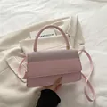 Elegant pink crossbody bag featuring glittery patchwork and golden metal accents - Pink