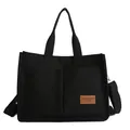 Minimalist black canvas tote bag with brown leather patch and adjustable strap - Black