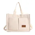 Cream canvas tote bag with front pockets and long shoulder strap for daily commuting - White