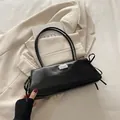 Minimalist black faux leather baguette bag with dual straps and silver metal logo - Black