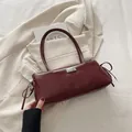 Deep burgundy glossy PU leather baguette bag with side bows and metal plate detail - Red