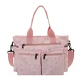 Roze bloemen shopper met strikprint voorzien van vele vakken en verstelbare riem - Roze