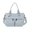 Lichtblauwe shopper met bloemenprint, meerdere ritsvakken en afneembare schouderriem - Blauw