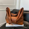 Vintage brown leather tote bag with geometric hollow design and large capacity - Brown