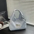 Sac fourre-tout bleu clair avec étoiles argentées et écusson chiot à paillettes brillant - Bleu